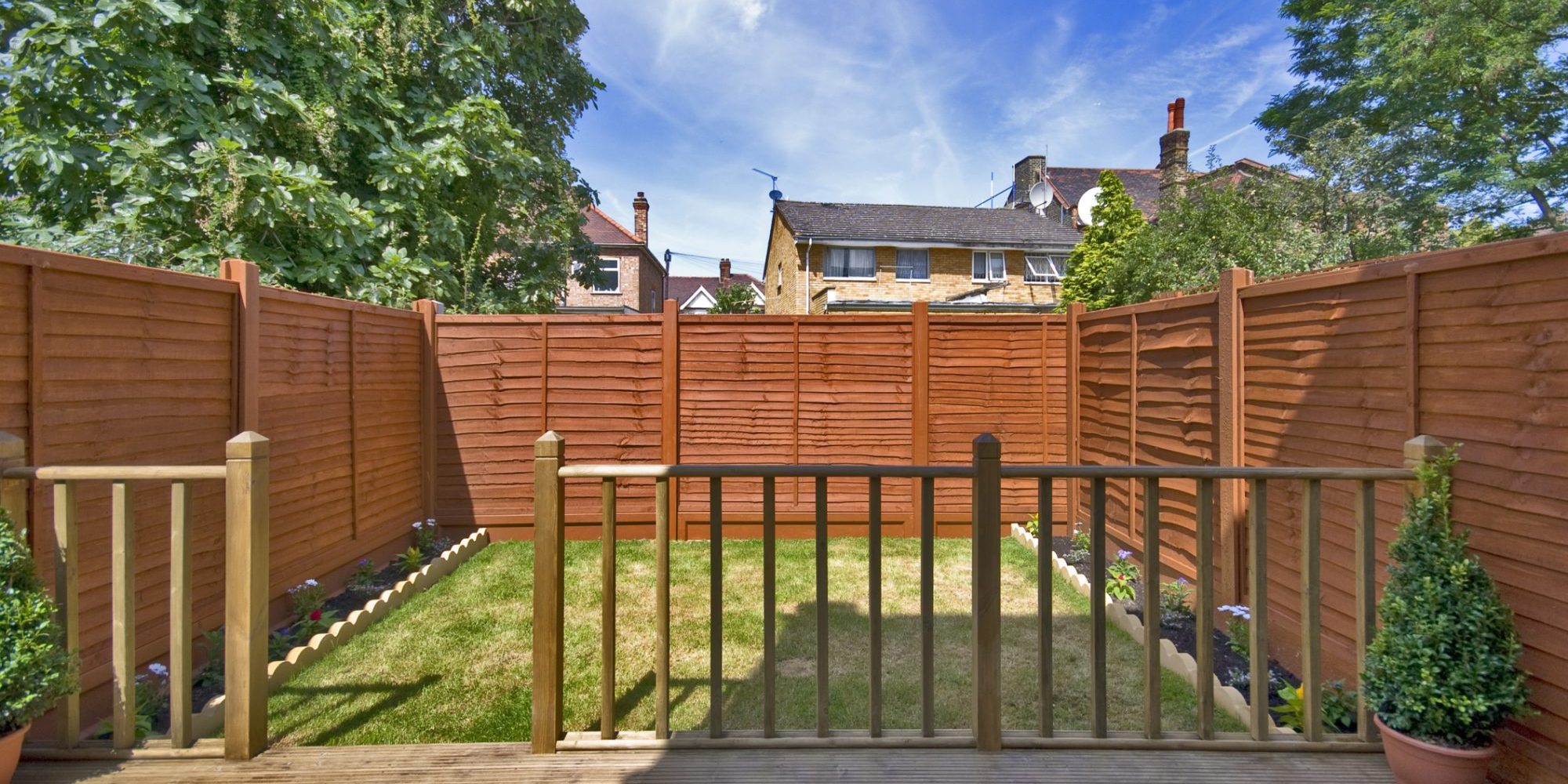 Garden with fence panels and wood decking