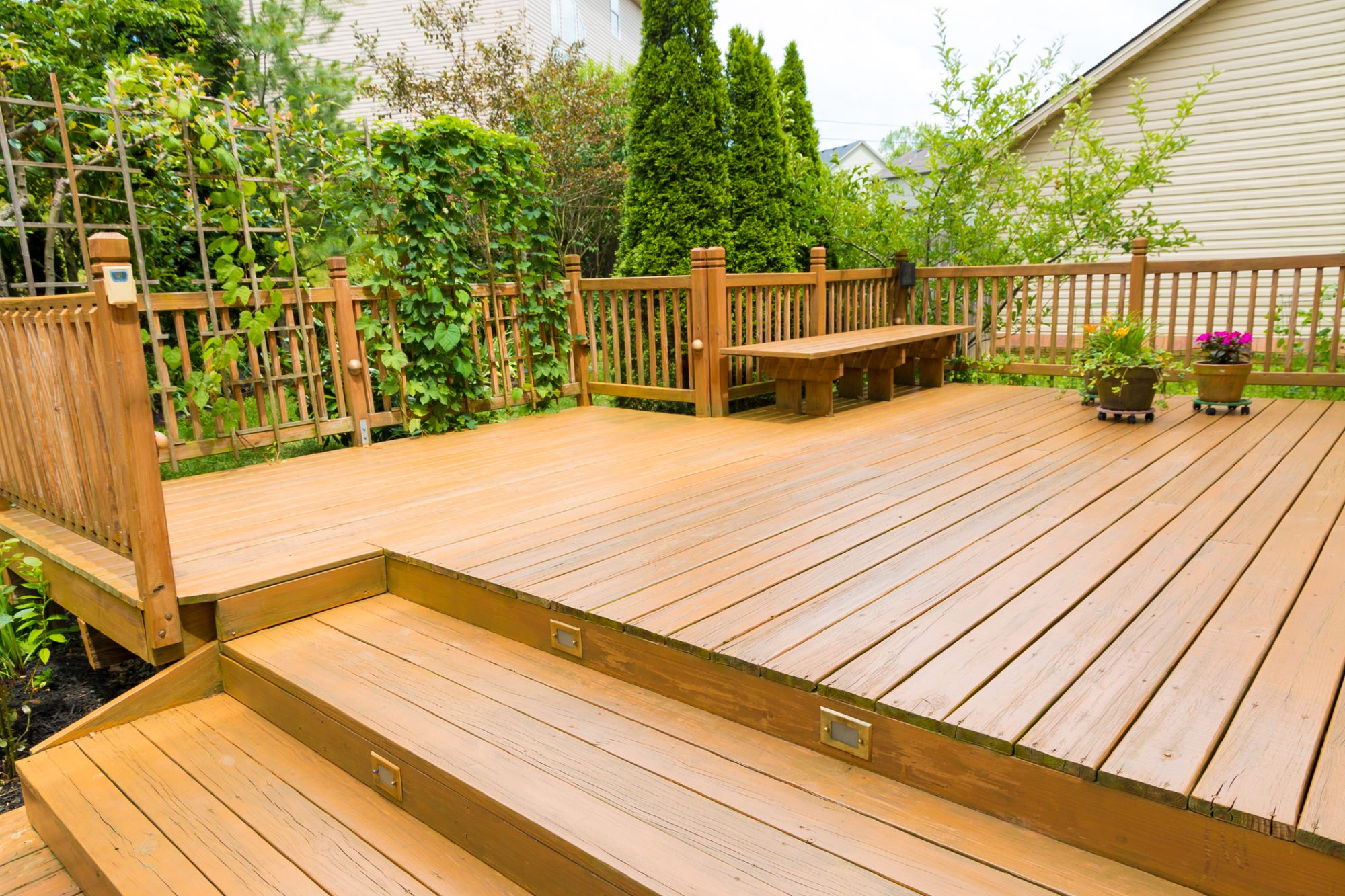 Wooden deck of family home at summer time.